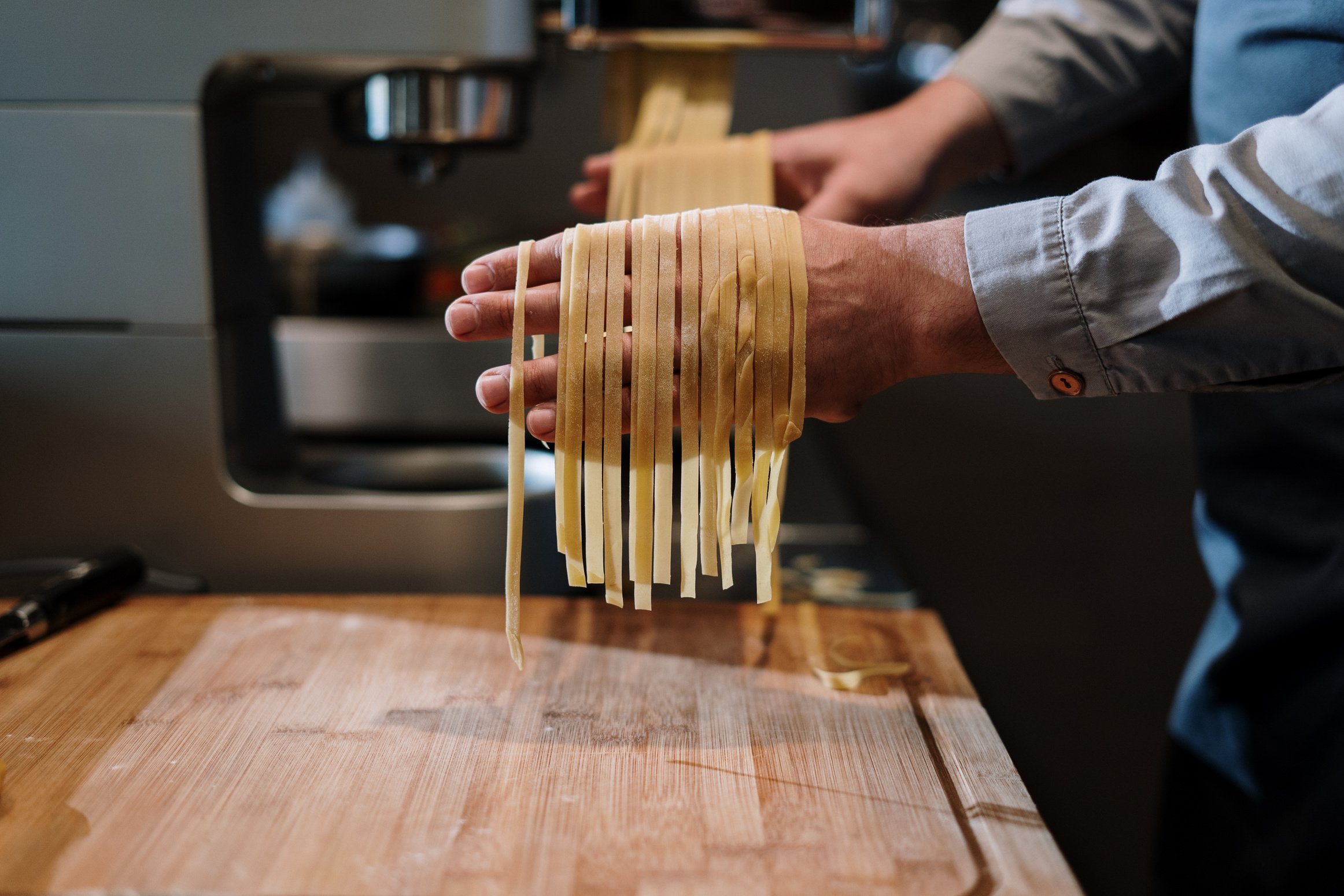 Person Holding Brown Wooden Sticks